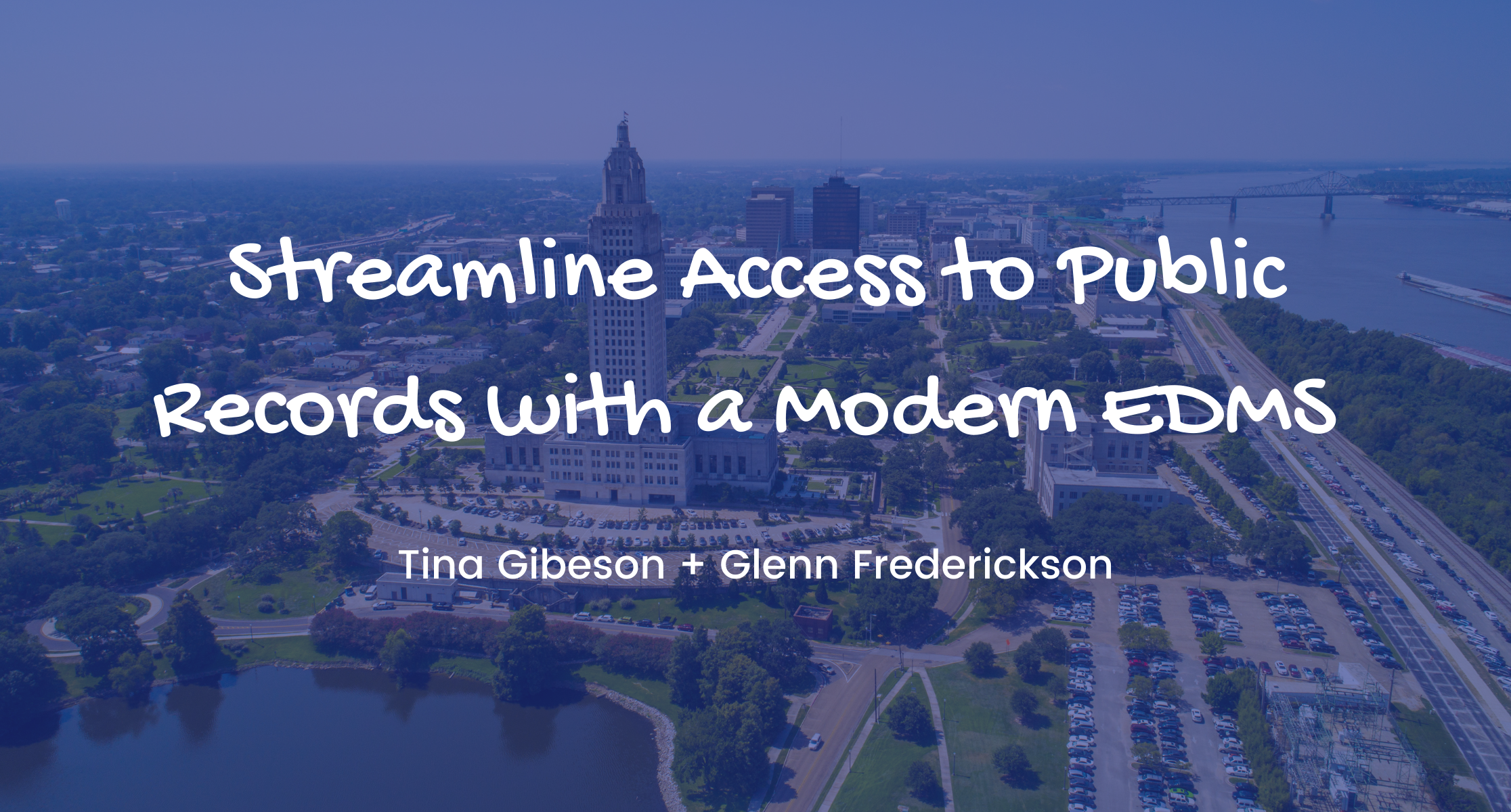 Aerial city view with a river and government buildings, featuring Public Records Access and EDMS modernization.